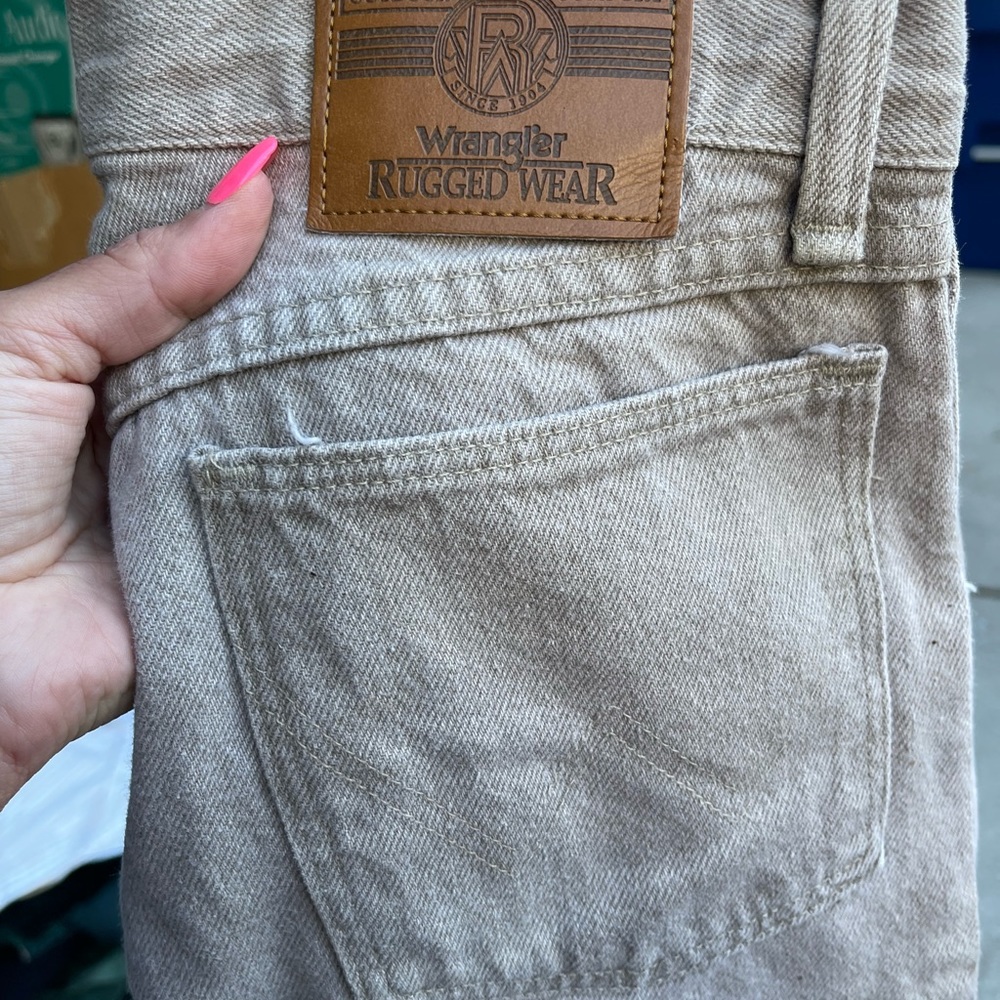 Woman’s tan western jeans